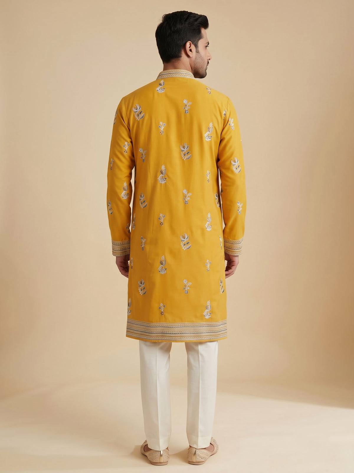 Mustard yellow georgette kurta suit with swan motif embellishments