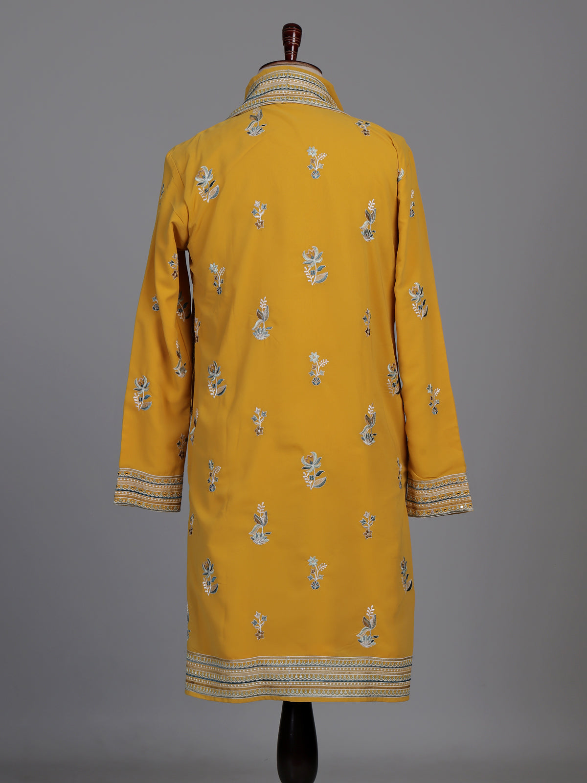Mustard yellow georgette kurta suit with swan motif embellishments
