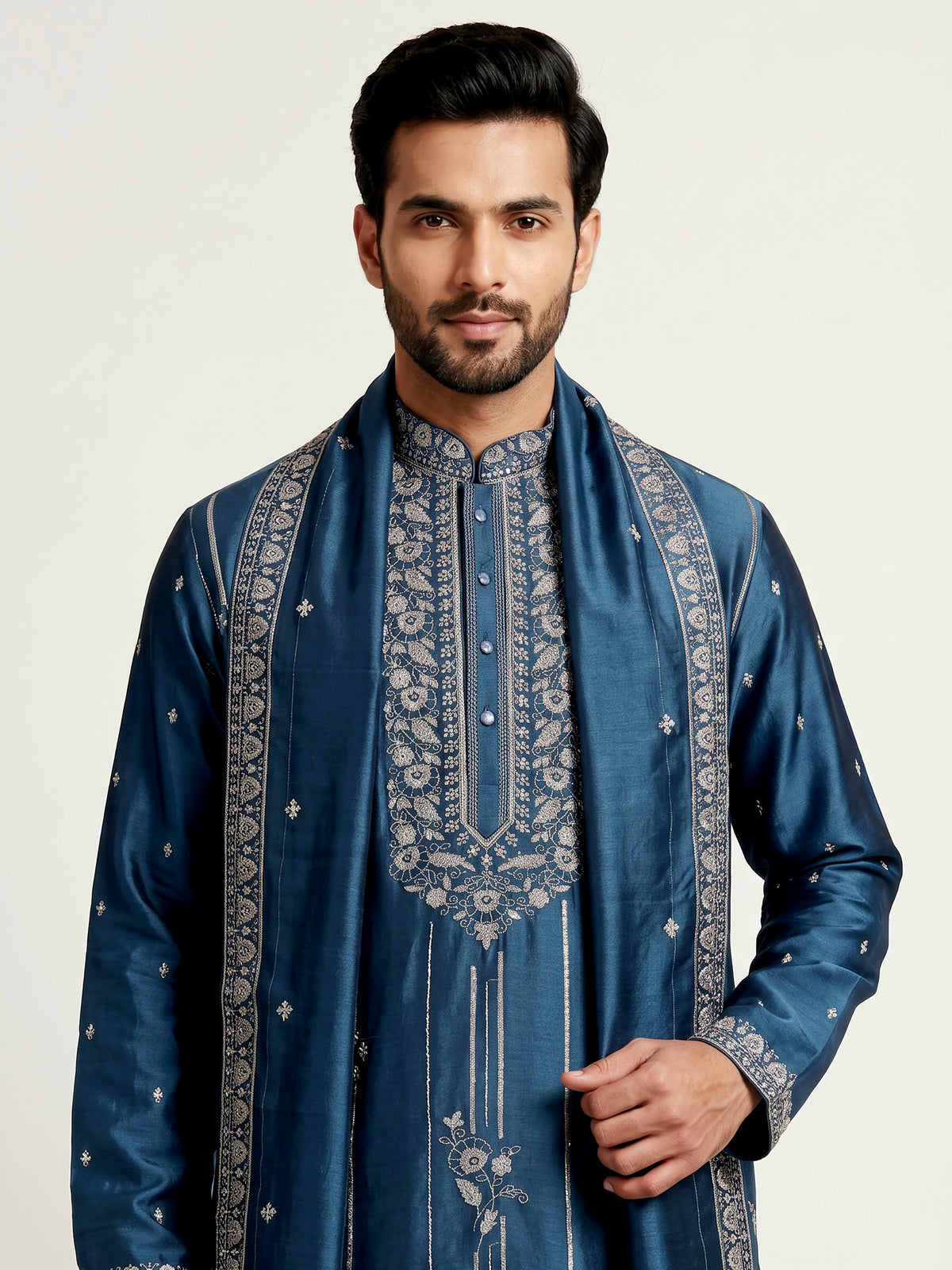 Deep teal silk kurta suit with golden embroidered neckline