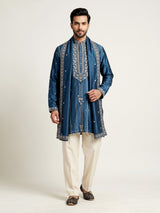 Deep teal silk kurta suit with golden embroidered neckline