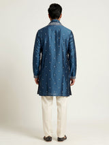 Deep teal silk kurta suit with golden embroidered neckline