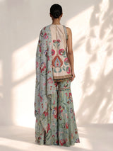 Pista green pakistani sharara suit with bird motifs and embroidery