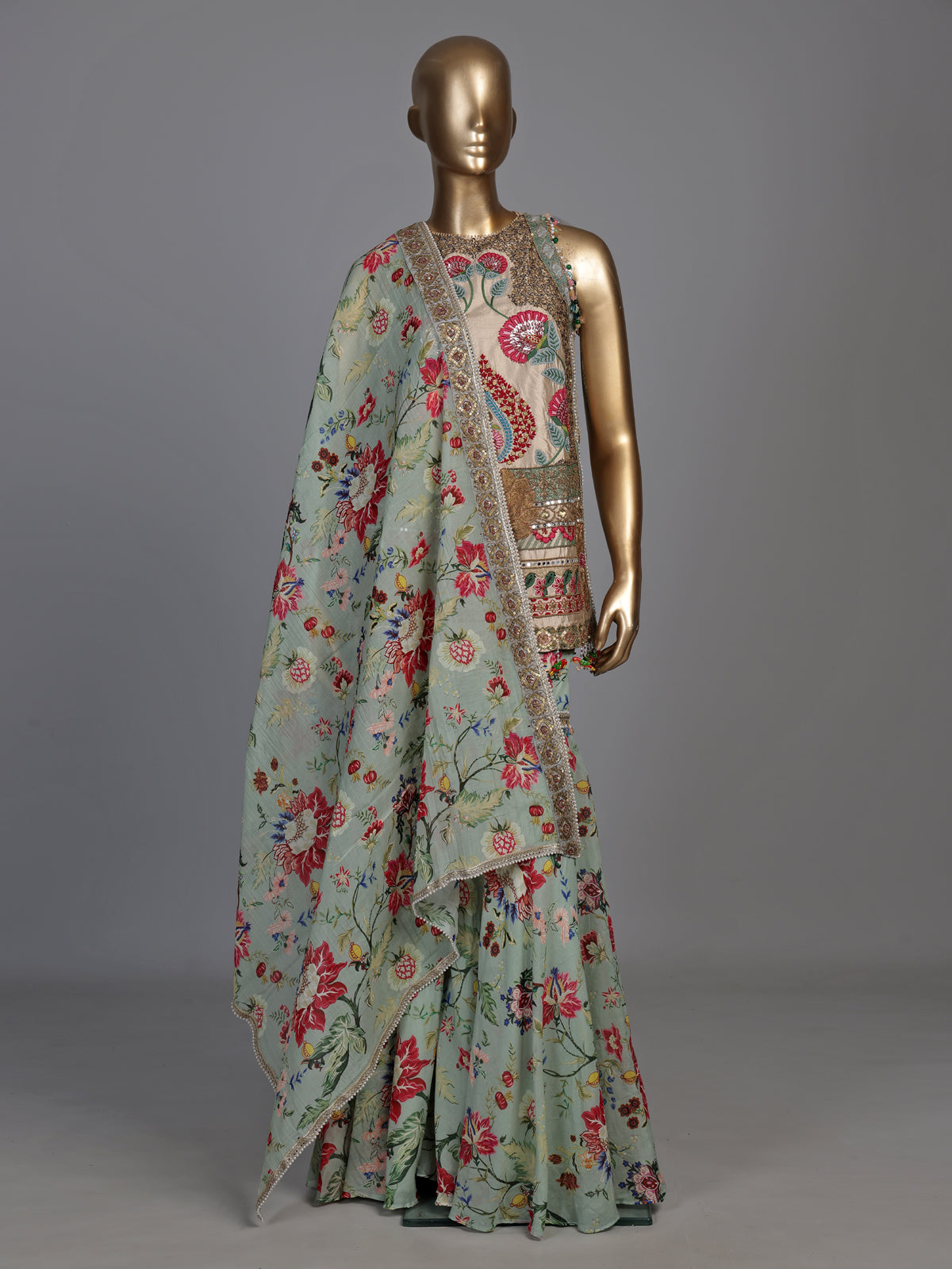 Pista green pakistani sharara suit with bird motifs and embroidery