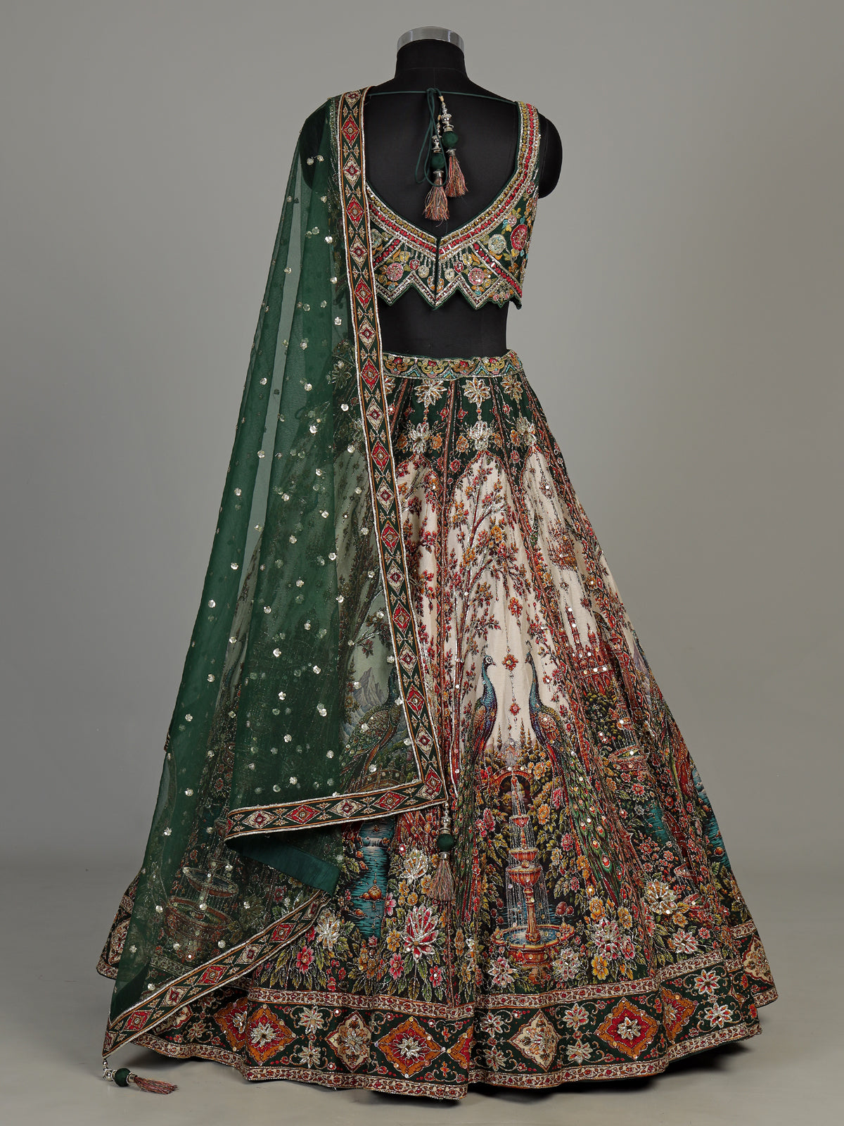 Green silk peacock motif lehenga choli with zardosi detailing