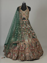 Green silk floral lehenga choli with halter neck embellishments