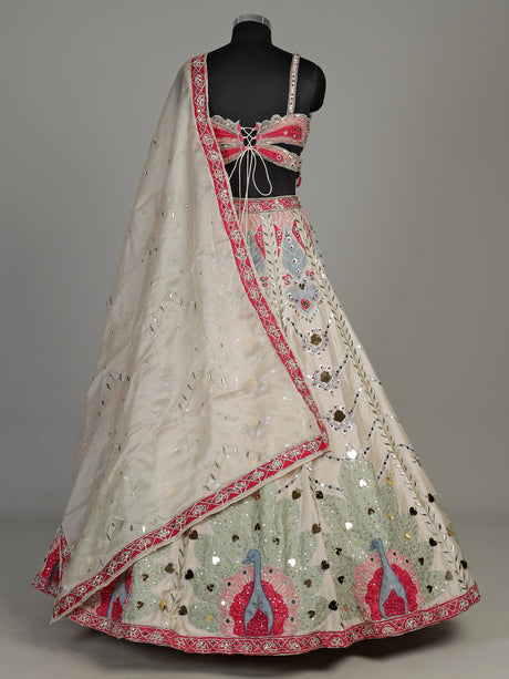 Beige raw silk peacock motif lehenga choli with mirror embellishments
