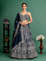 Peacock blue silk lehenga choli with heavy tassel embellishments