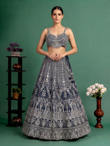 Peacock blue silk lehenga choli with heavy tassel embellishments