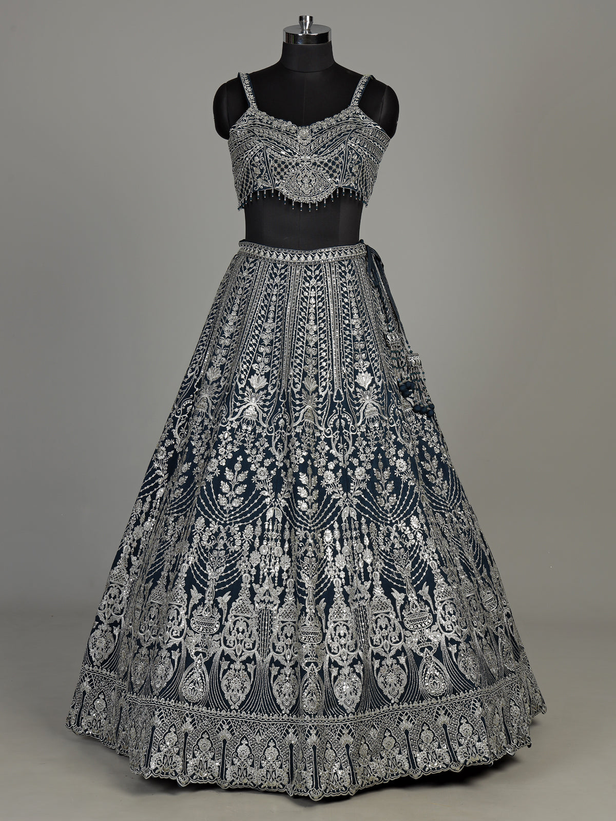 Peacock blue silk lehenga choli with heavy tassel embellishments