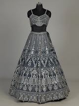 Peacock blue silk lehenga choli with heavy tassel embellishments