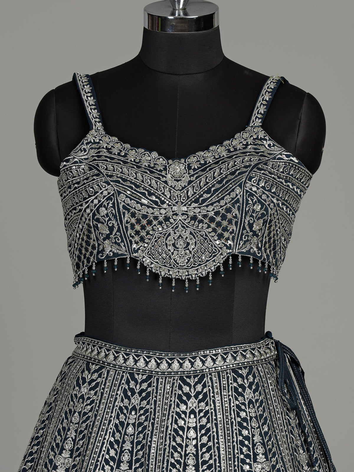 Peacock blue silk lehenga choli with heavy tassel embellishments