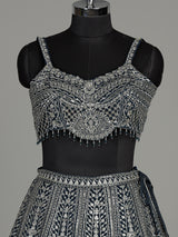 Peacock blue silk lehenga choli with heavy tassel embellishments