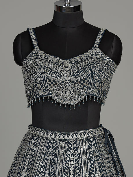 Peacock blue silk lehenga choli with heavy tassel embellishments