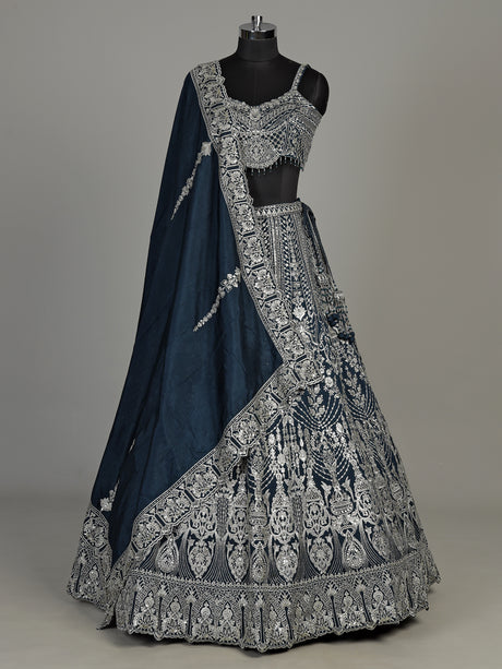 Peacock blue silk lehenga choli with heavy tassel embellishments