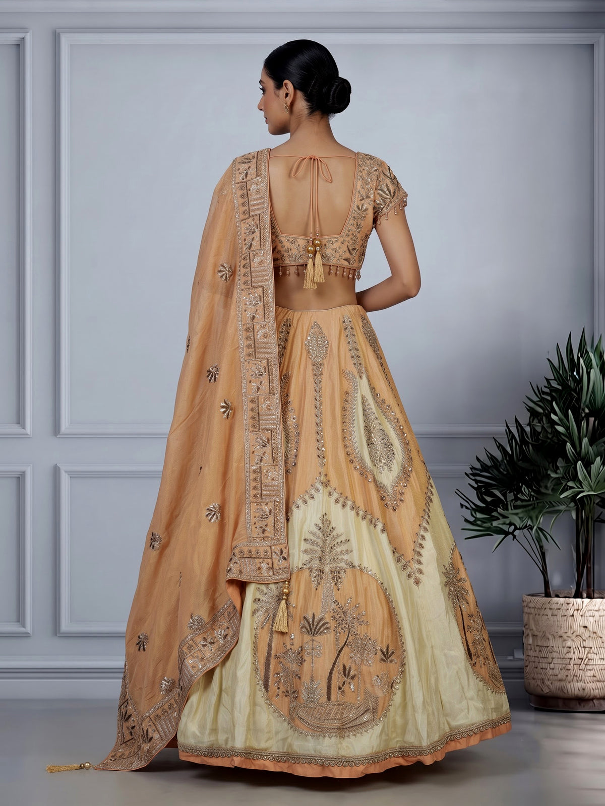Peach silk lehenga choli with zardosi cap sleeve embellishments