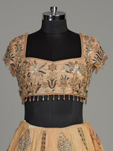 Peach silk lehenga choli with zardosi cap sleeve embellishments
