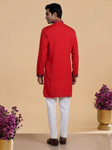 Scarlet red crepe silk kurta suit with antique silver embellished bib