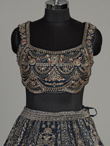 Teal blue silk lehenga choli with square neck zari embellishments