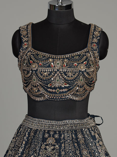 Teal blue silk lehenga choli with square neck zari embellishments