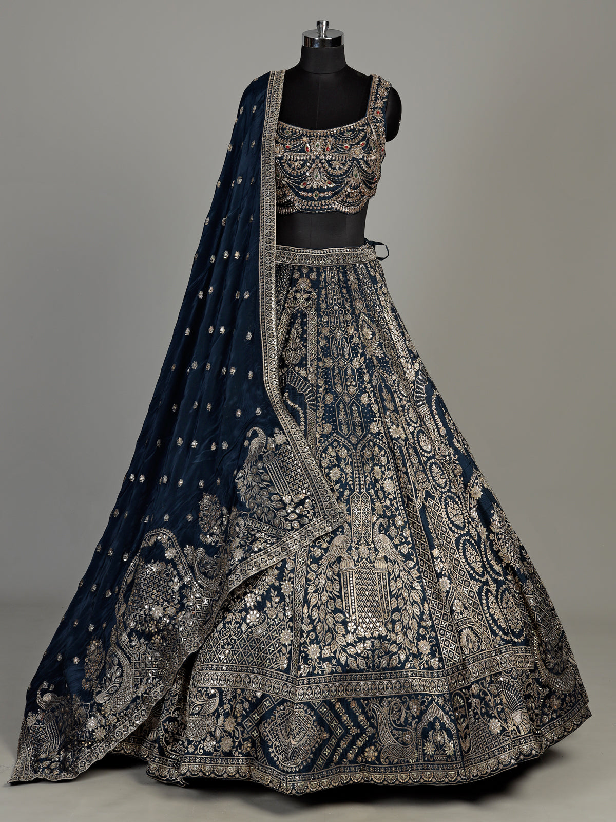 Teal blue silk lehenga choli with square neck zari embellishments