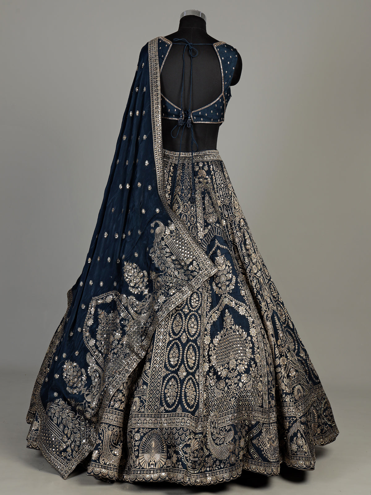 Teal blue silk lehenga choli with square neck zari embellishments