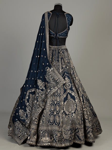 Teal blue silk lehenga choli with square neck zari embellishments