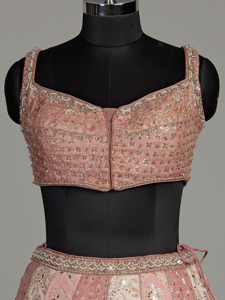 Peach silk lehenga choli with exquisite mirror zari embellishments