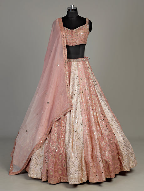 Peach silk lehenga choli with exquisite mirror zari embellishments