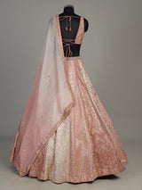 Peach silk lehenga choli with exquisite mirror zari embellishments