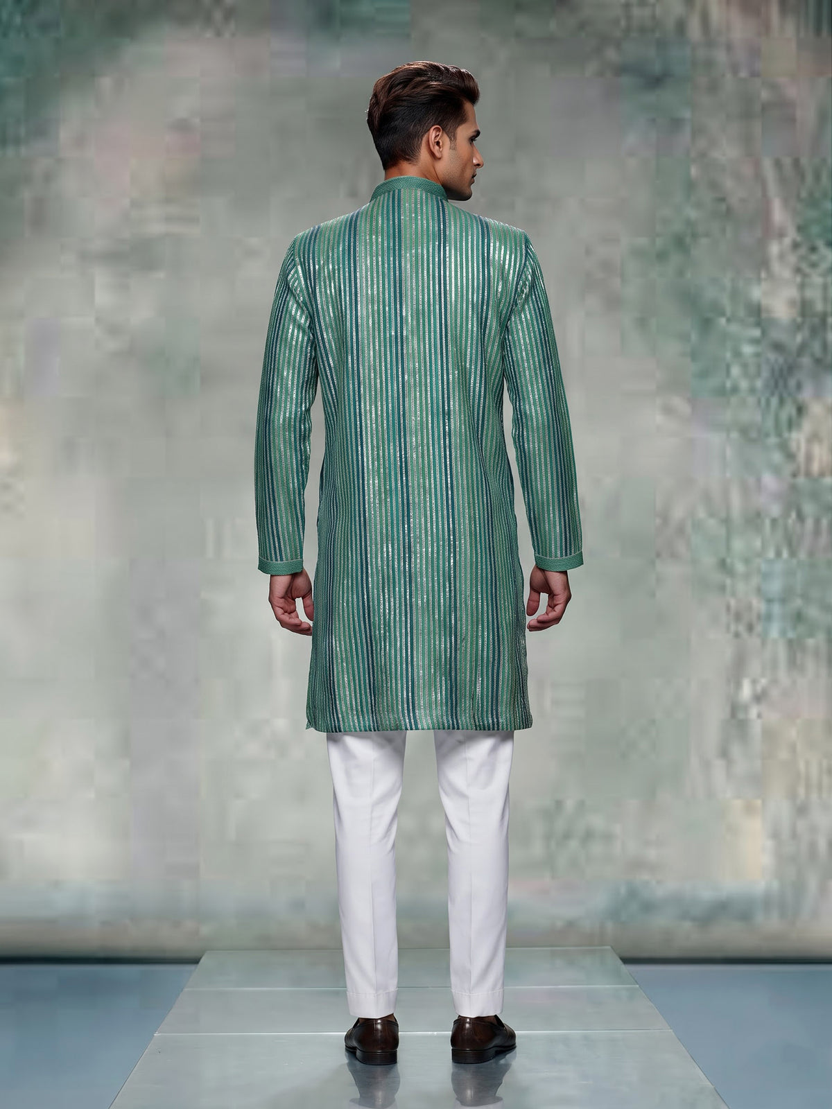 Emerald green kurta suit with shimmering silver gota patti stripes