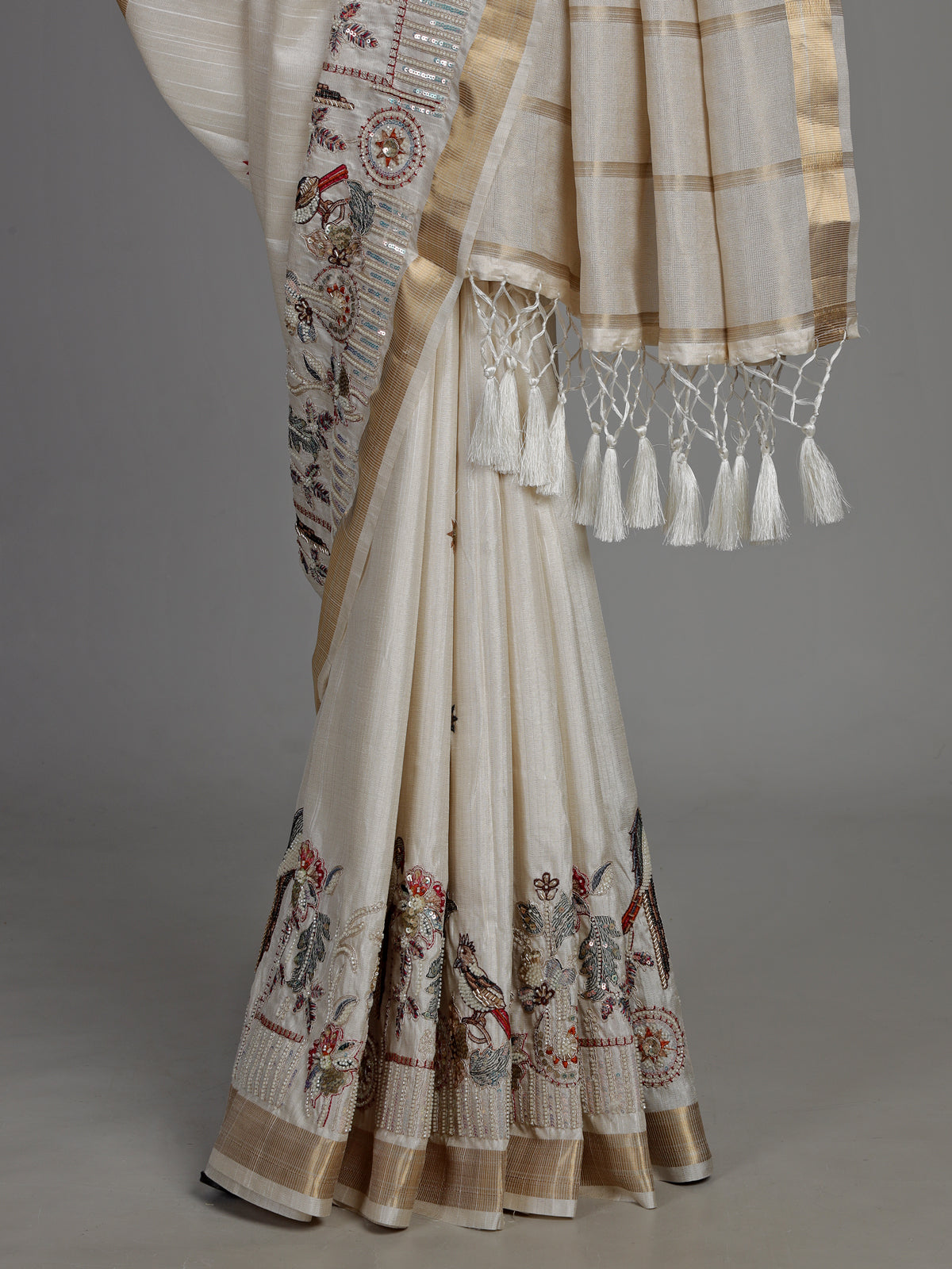 White semi cotton silk saree with embellished bird motifs and tasselled pallu