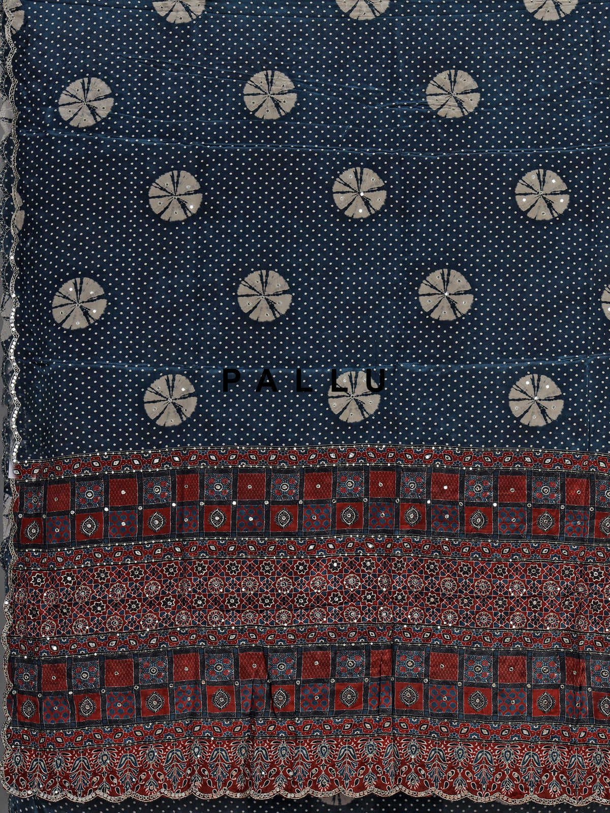 Blue crepe silk saree with printed patterns and traditional aabla work