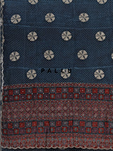 Blue crepe silk saree with printed patterns and traditional aabla work