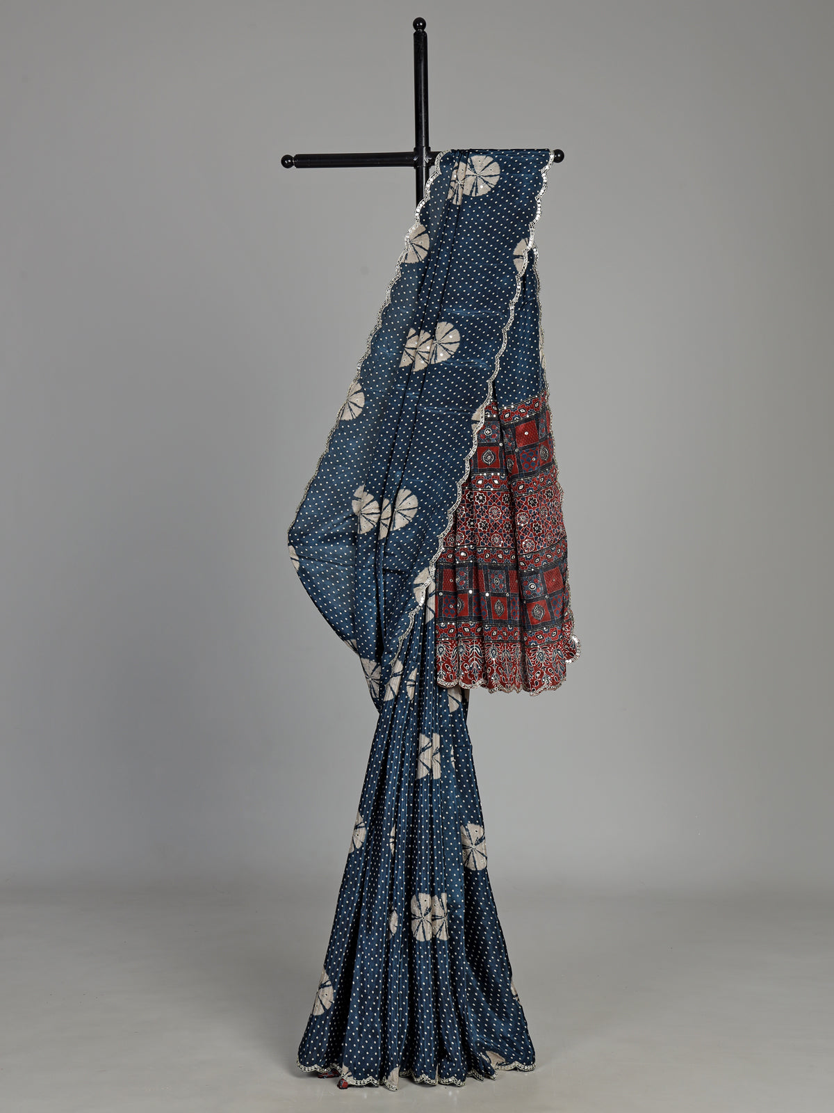 Blue crepe silk saree with printed patterns and traditional aabla work