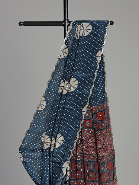 Blue crepe silk saree with printed patterns and traditional aabla work