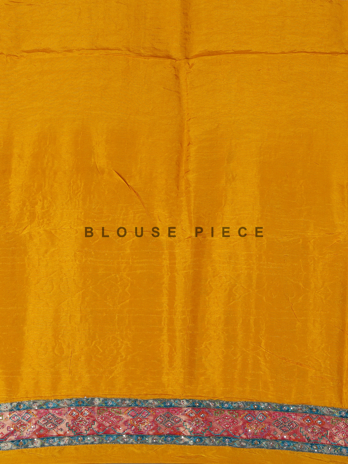 Mustard yellow modal satin saree with colourful motifs and tassel detailing