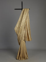Cream tissue silk saree with mirror accents and intricate festive embroidery