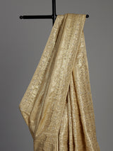 Cream tissue silk saree with mirror accents and intricate festive embroidery