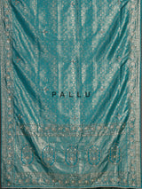 Aqua kanjivaram silk saree with ornate mirror work and zari accents