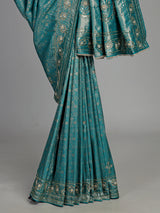 Aqua kanjivaram silk saree with ornate mirror work and zari accents