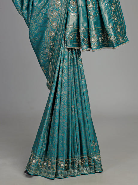 Aqua kanjivaram silk saree with ornate mirror work and zari accents