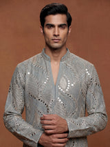 Pastel mint blue silk kurta set with embellished swirl embroidery
