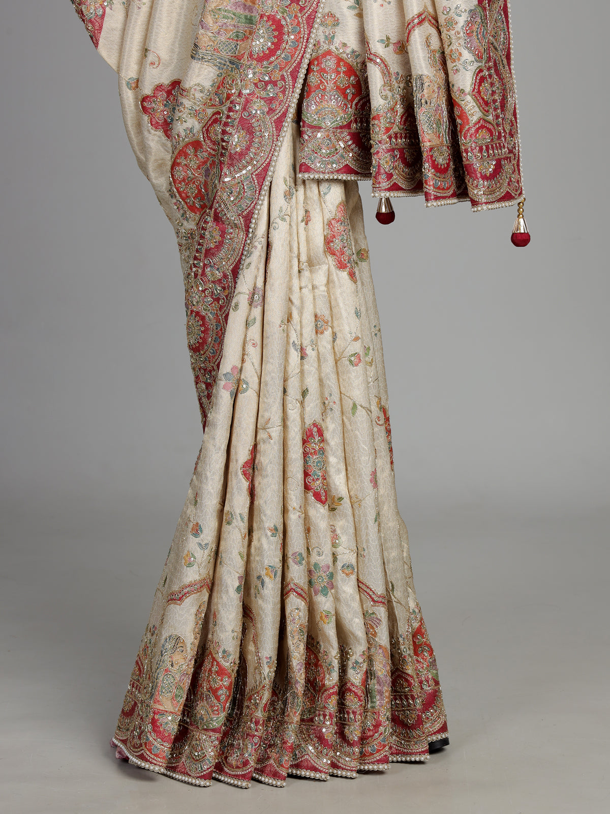 Cream pashmina saree with floral embroidery and contrasting zari pallu