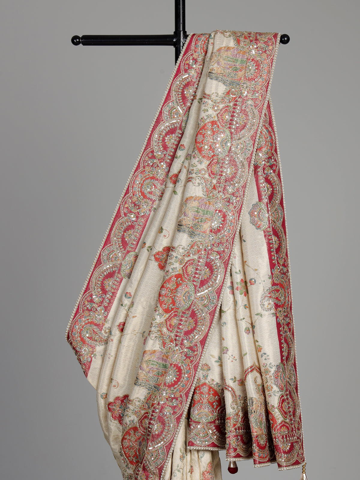Cream pashmina saree with floral embroidery and contrasting zari pallu