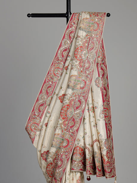 Cream pashmina saree with floral embroidery and contrasting zari pallu
