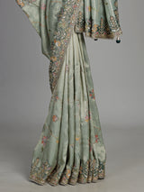 Pastel mint green pashmina saree with floral and bird embroidery