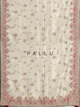 Cream pojisan silk saree with floral motifs and ornate zardosi embroidery