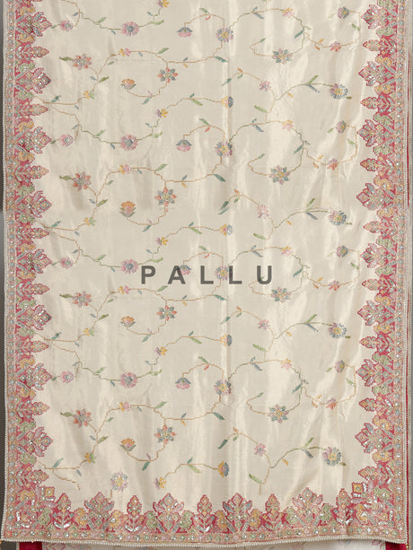 Cream pojisan silk saree with floral motifs and ornate zardosi embroidery