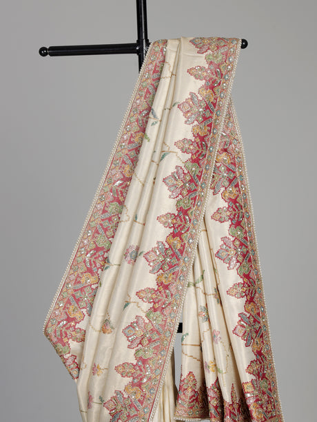 Cream pojisan silk saree with floral motifs and ornate zardosi embroidery