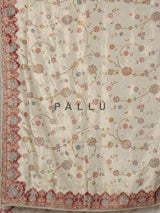 Cream pashmina saree with floral motifs and contrasting embellished border